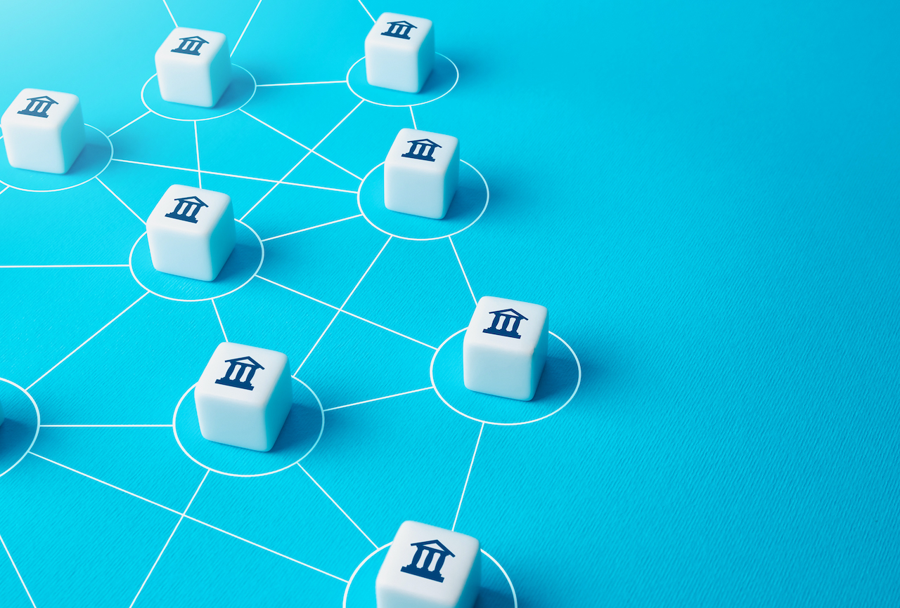 A dice with government icons on top showing how it is connected to another.